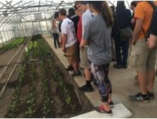 Students touring a greenhouse in Eden Hall